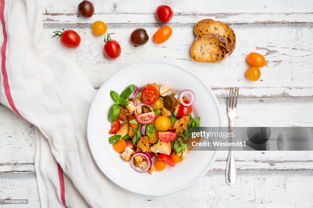Panzanella made of roasted Ciabatta, rocket, red onions, tomatoes and basil