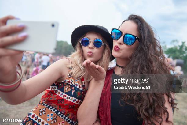 young people making selfie at music festival - festival selfie stock pictures, royalty-free photos & images