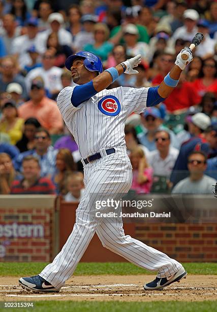 Derrek Lee of the Chicago Cubs hits the ball against the Los Angeles Angels of Anaheim at Wrigley Field on June 20, 2010 in Chicago, Illinois. The...