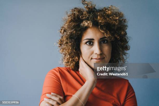 portrait of a pensive woman with hand on chin - 30 34 years stock pictures, royalty-free photos & images