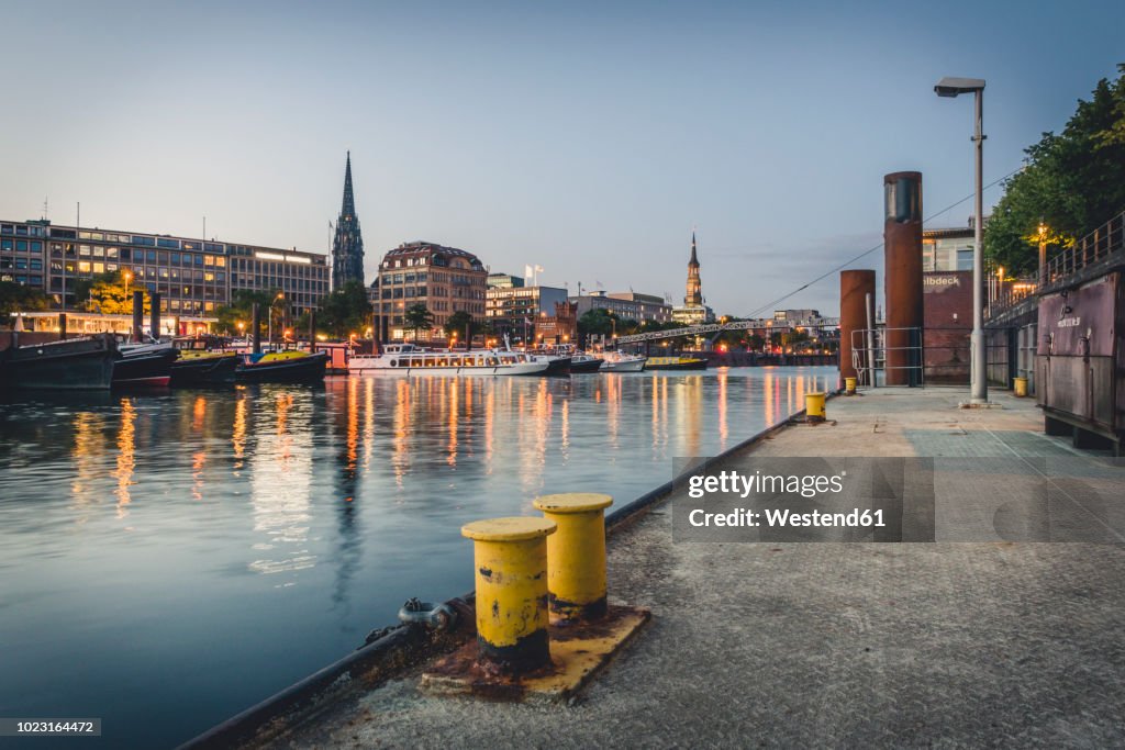 Germany, Hamburg, inland harbour and cityscape at blue hour