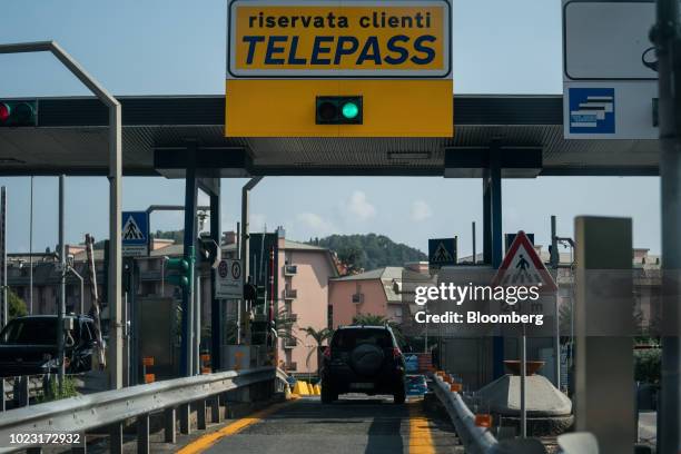 Traffic approaches a toll booth on the A12 Highway operated by Autostrade per l'Italia SpA, near Genoa, Italy, on Friday, Aug. 24, 2018. Italy's...