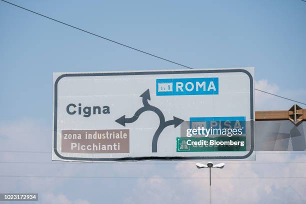 Signage on Highway 223 indicates directions for Roma and Pisa, near Genoa, Italy, on Friday, Aug. 24, 2018. Italy's Deputy Prime Minister Matteo...