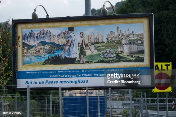 Billboard displays an advertisement for a rest area operated by Autostrade per l'Italia SpA, on the A7 Highway near Genoa, Italy, on Friday, Aug. 24,...