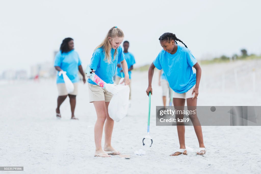 Volunteers Picking Up Trash From Beach High-Res Stock Photo - Getty Images