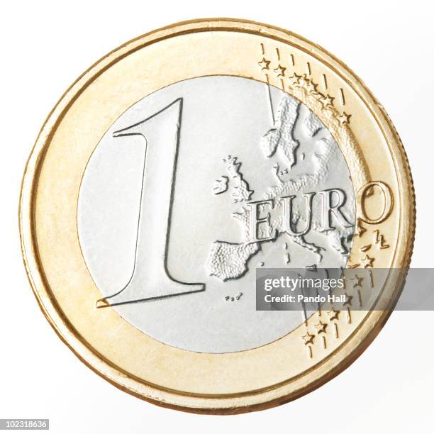 european currency: one euro coin, close-up - european union stock pictures, royalty-free photos & images
