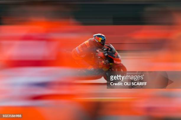 Red Bull KTM Factory Racing's British rider Bradley Smith competes during a MotoGP qualifying session of the motorcycling British Grand Prix at...