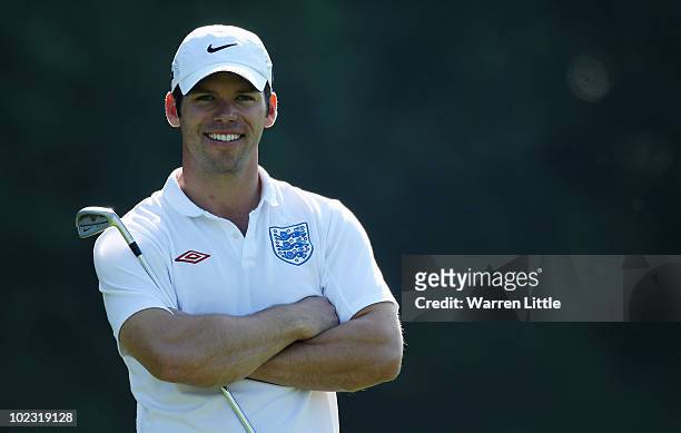 Paul Casey of England sports an England football shirt ahead of the World Cup football game today between England and Slovenia pictured during the...