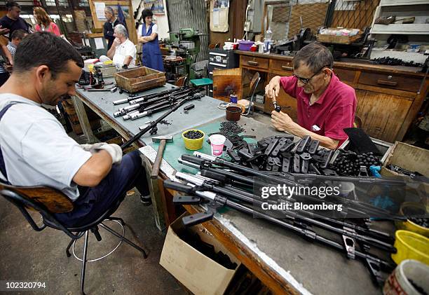 Employees work on the assembly of the M84 machine gun at the Zastava Arms factory, in Kragujevac, Serbia, on Tuesday, June 22, 2010. Zastava Arms...