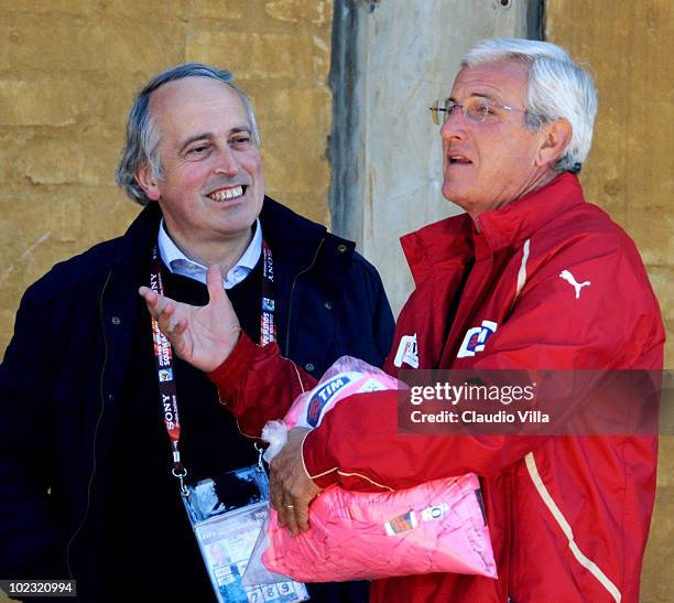 Italy head coach Marcello Lippi and President FIGC Giancarlo Abete chat during an Italy training session at the 2010 FIFA World Cup on June 23, 2010...