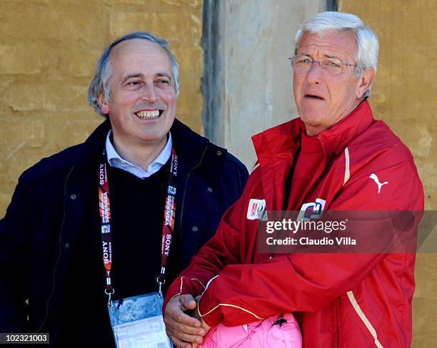 Italy head coach Marcello Lippi and President FIGC Giancarlo Abete chat during an Italy training session at the 2010 FIFA World Cup on June 23, 2010...