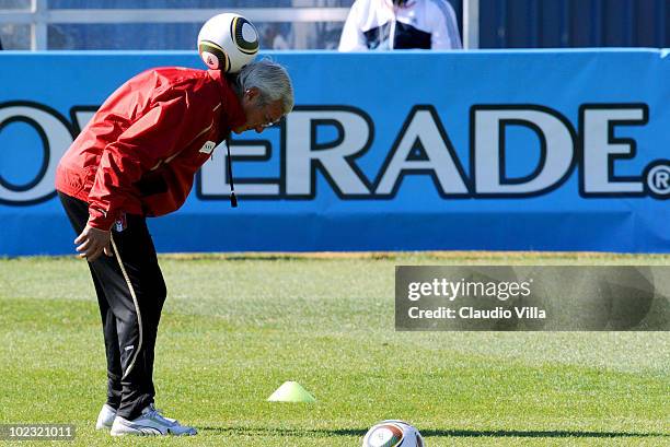 Italy Head Coach Marcello Lippi balances a ball on his neck during an Italy training session at the 2010 FIFA World Cup on June 23, 2010 in...