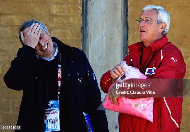 Italy head coach Marcello Lippi and President FIGC Giancarlo Abete chat during an Italy training session at the 2010 FIFA World Cup on June 23, 2010...