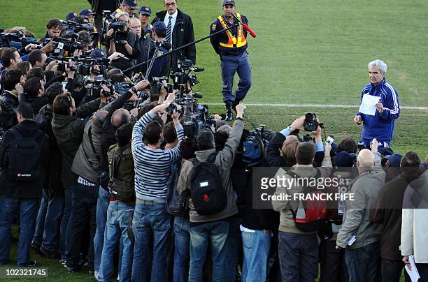 France's coach Raymond Domenech speaks in front of journalists at the Fields of Dreams stadium in Knysna on June 20, 2010 during the 2010 World Cup...