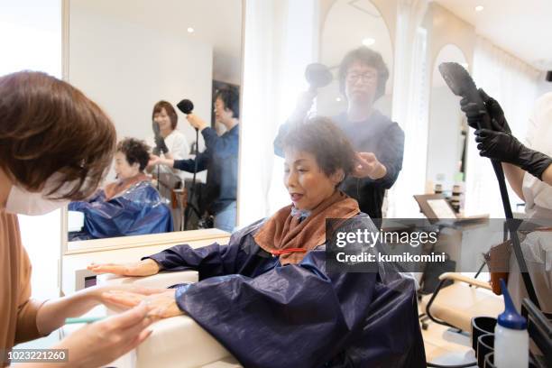 japanese senior woman having beauty treatment - old cinderella stock pictures, royalty-free photos & images