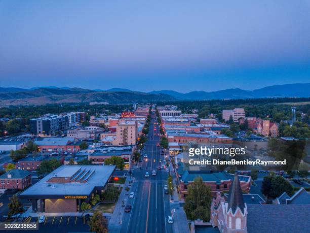 aerial view of downtown bozeman at twilight - bozeman stock pictures, royalty-free photos & images