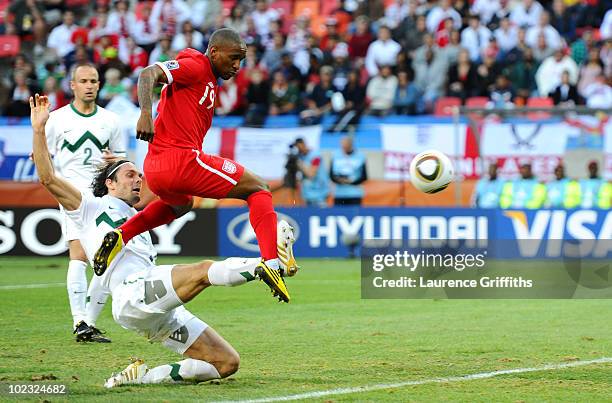 Jermain Defoe of England scores the opening goal during the 2010 FIFA World Cup South Africa Group C match between Slovenia and England at the Nelson...