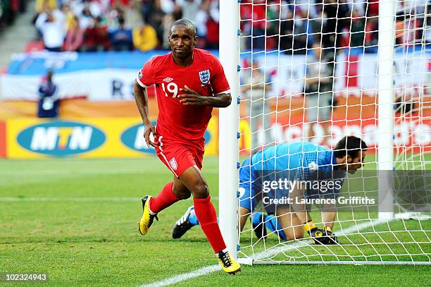 Jermain Defoe of England celebrates scoring the opening goal past Samir Handanovic of Slovenia during the 2010 FIFA World Cup South Africa Group C...