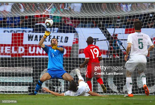Jermain Defoe of England scores the opening goal past Samir Handanovic of Slovenia during the 2010 FIFA World Cup South Africa Group C match between...
