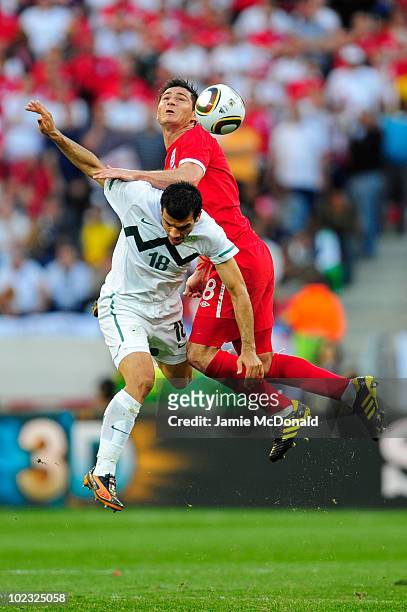 Frank Lampard of England and Aleksandar Radosavljevic of Slovenia challenge for the ball in the air during the 2010 FIFA World Cup South Africa Group...