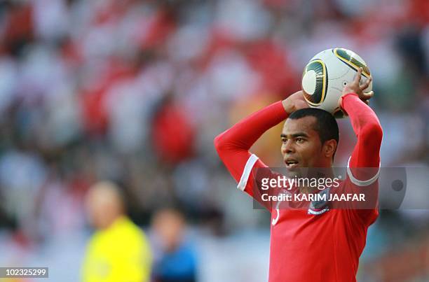 England's defender Ashley Cole throws in the ball during the Group C first round 2010 World Cup football match Slovenia vs. England on June 23, 2010...