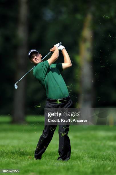 Martin Kaymer of Germany plays his approach shot into The seventh green during The Pro-Am of The BMW International Open Golf at The Munich North...