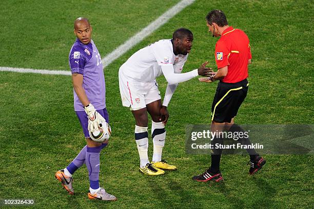 Referee Frank de Bleeckere speaks to Jozy Altidore of the United States during the 2010 FIFA World Cup South Africa Group C match between USA and...