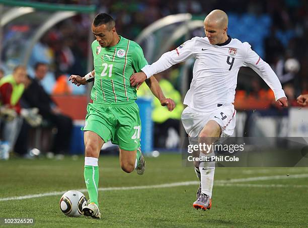 Michael Bradley of the United States closes down Foued Kadir of Algeria during the 2010 FIFA World Cup South Africa Group C match between USA and...