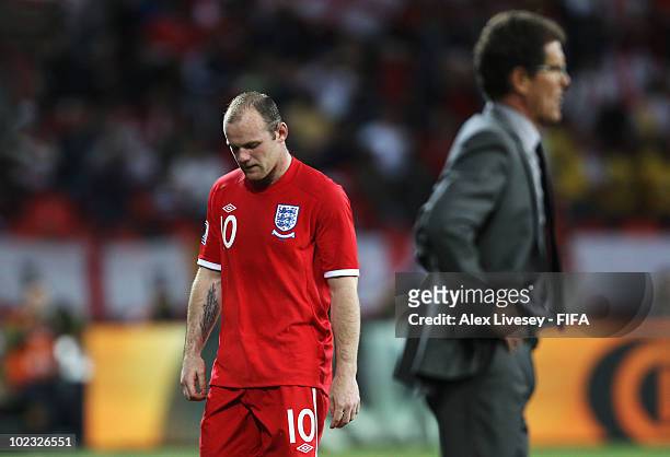 Wayne Rooney of England looks dejected as he is substituted while Fabio Capello manager of England looks on during the 2010 FIFA World Cup South...