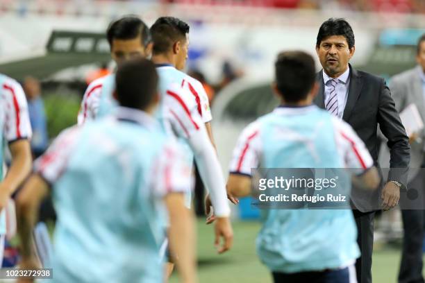 Jose Cardozo, coach of Chivas gives instructions to his players during the 6th round match between Chivas and Necaxa as part of the Torneo Apertura...
