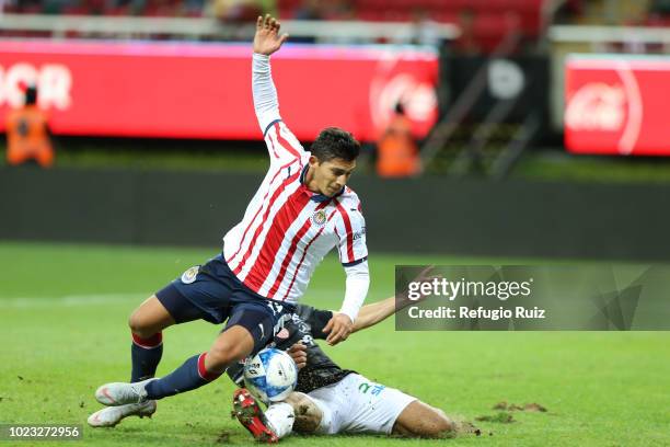 Angel Zaldivar of Chivas fights for the ball with Leobardo López of Necaxa during the 6th round match between Chivas and Necaxa as part of the Torneo...