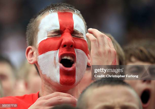 England fans react to tense moments while watching the England team beat Slovenia 1-0 on a giant screen in the Manchester fan zone on June 23, 2010...