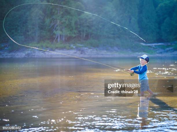 boy fly fishing - fly fishing foto e immagini stock