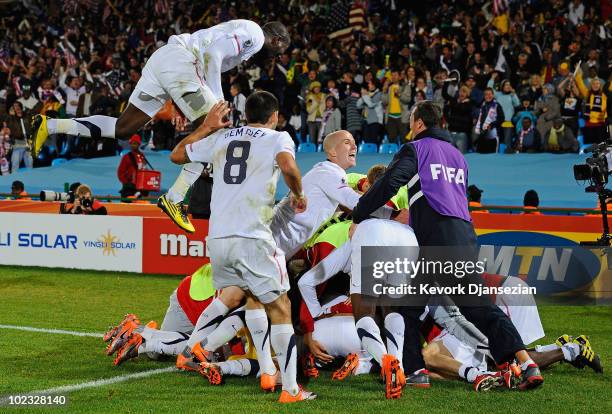 The USA team celebrate Landon Donovan's winning goal that sends the USA through to the second round during the 2010 FIFA World Cup South Africa Group...