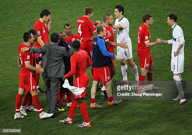 Fabio Capello manager of England celebrates victory with team mates following the 2010 FIFA World Cup South Africa Group C match between Slovenia and...