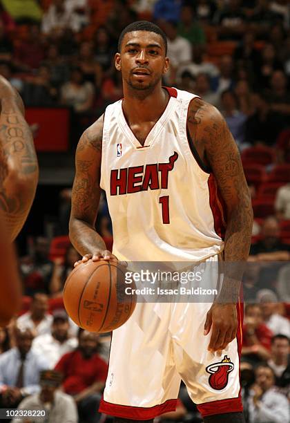 Dorell Wright of the Miami Heat handles the ball against the New Jersey Nets on April 14, 2010 at American Airlines Arena in Miami, Florida. NOTE TO...