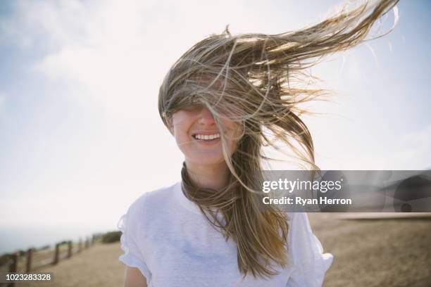 genießen sie die frische seeluft - beach hair stock-fotos und bilder