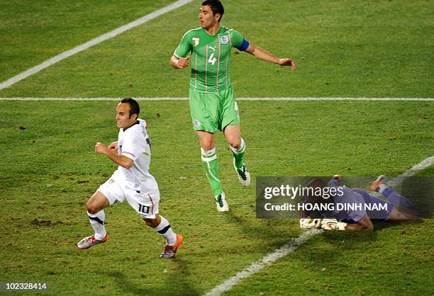Midfielder Landon Donovan runs off after scoring past Algeria's goalkeeper M'bolhi Rais Ouheb during their Group C first round 2010 World Cup...