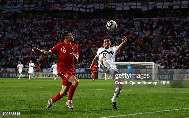 James Milner of England in action against Andraz Kirm of Slovenia during the 2010 FIFA World Cup South Africa Group C match between Slovenia and...