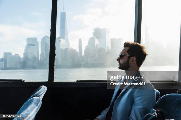 usa,new york city, businessman on passenger deck of a ferry - commuter ferry stock pictures, royalty-free photos & images