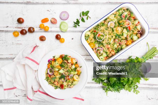 couscous salad with tomatoes, cucumber, parsley and mint - flat leaf parsley - fotografias e filmes do acervo