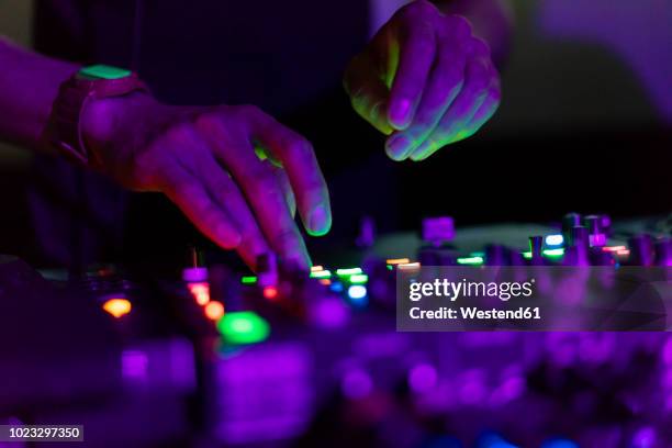 dj working on mixing board - edm dj stock pictures, royalty-free photos & images