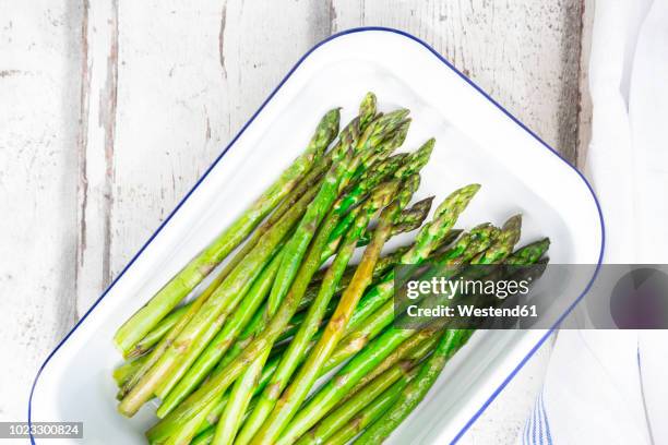 boiled organic green asparagus in souffle dish - cooked asparagus stock pictures, royalty-free photos & images