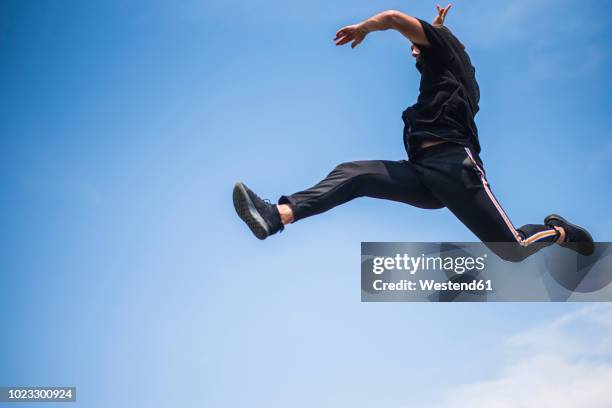 man jumping in the air - challenge launch stock pictures, royalty-free photos & images