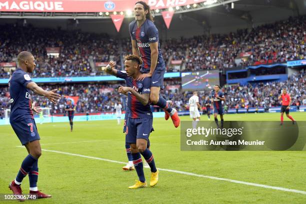 Kylian Mbappe and Edinson Cavani congratulate Neymar Jr after his goal during the Ligue 1 match between Paris Saint-Germain and Angers SCO at Parc...