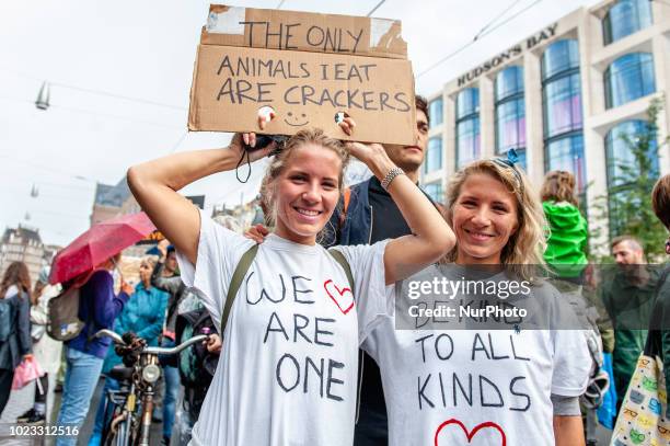 People take part in Animal rights march in Amsterdam, Netherlands, on August 25, 2018. Thousands of animal lovers gathered around the Dam square in...