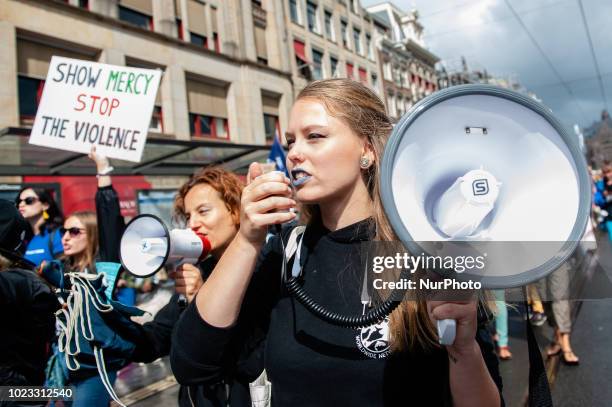 People take part in Animal rights march in Amsterdam, Netherlands, on August 25, 2018. Thousands of animal lovers gathered around the Dam square in...