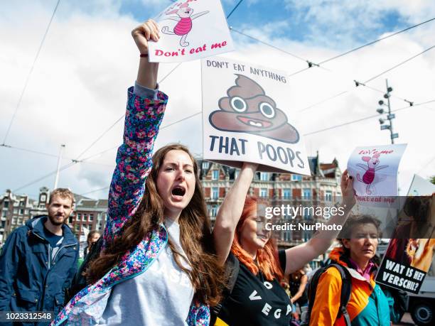 People take part in Animal rights march in Amsterdam, Netherlands, on August 25, 2018. Thousands of animal lovers gathered around the Dam square in...