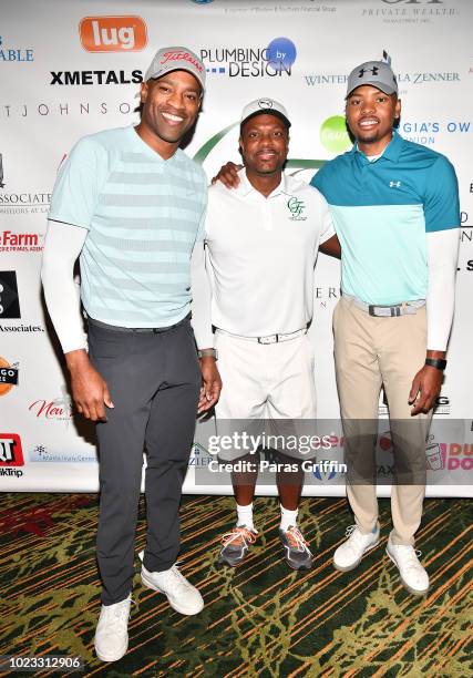 Player Vince Carter, actor Chris Tucker and NBA Player Kent Bazemore attend the Chris Tucker Foundation Celebrity Golf Tournament at Stone Mountain...