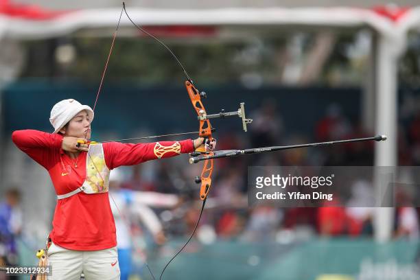 Zhang Xinyan of China in action during Archery Recurve Women's Team Quarterfinal between China and Kazakhstan on day seven of the Asian Games on...